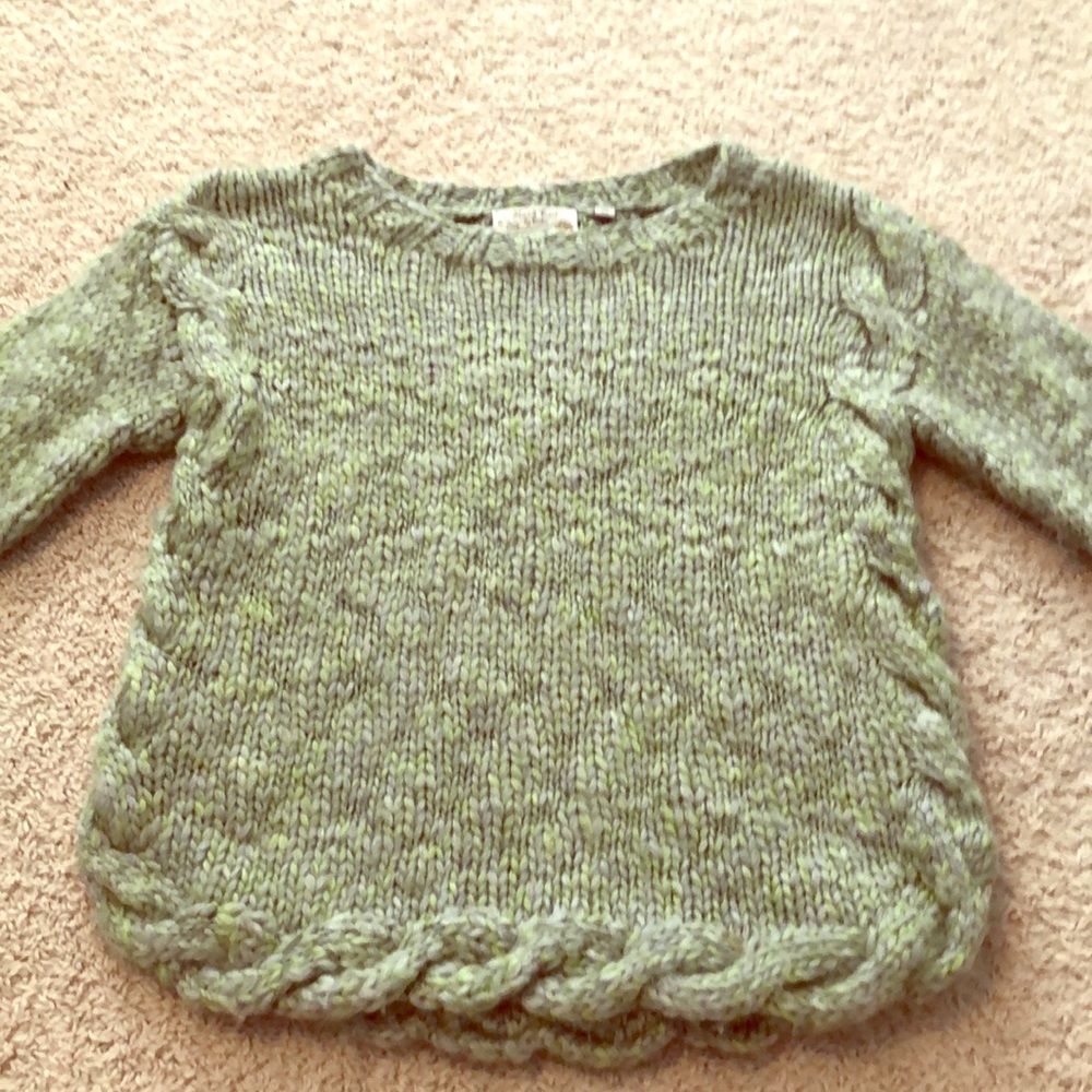 Green and blue sweater.